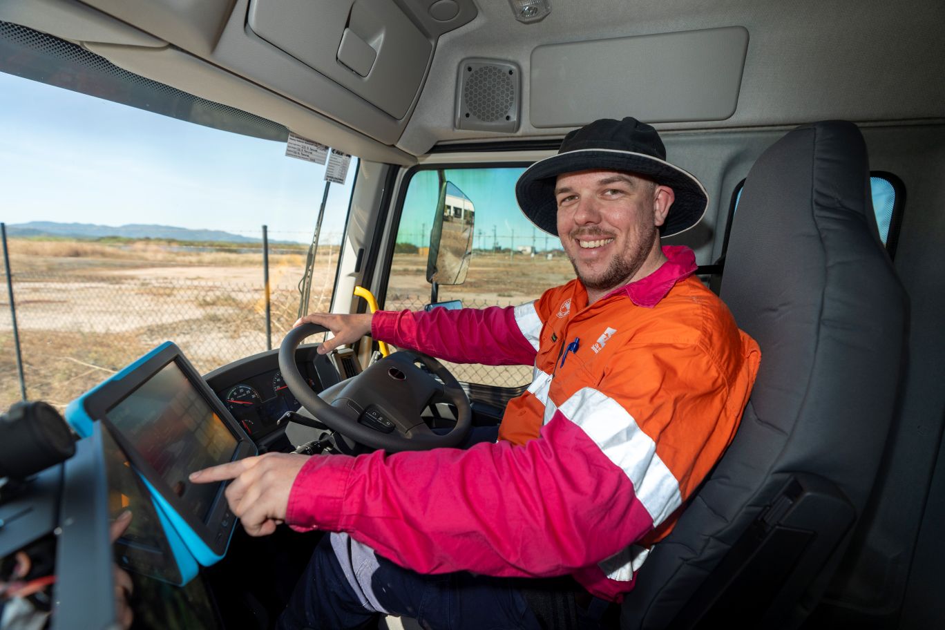 Waste and recycling truck driver Cameron Chisholm in one of Council's new AI equipped trucks