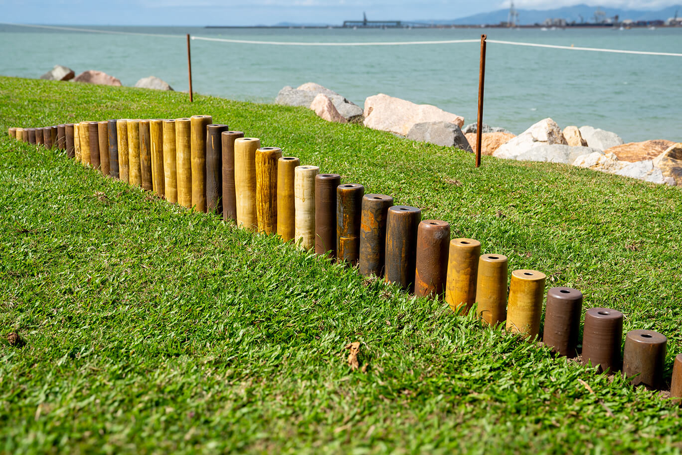 Ceramic vases of various heights in the grass