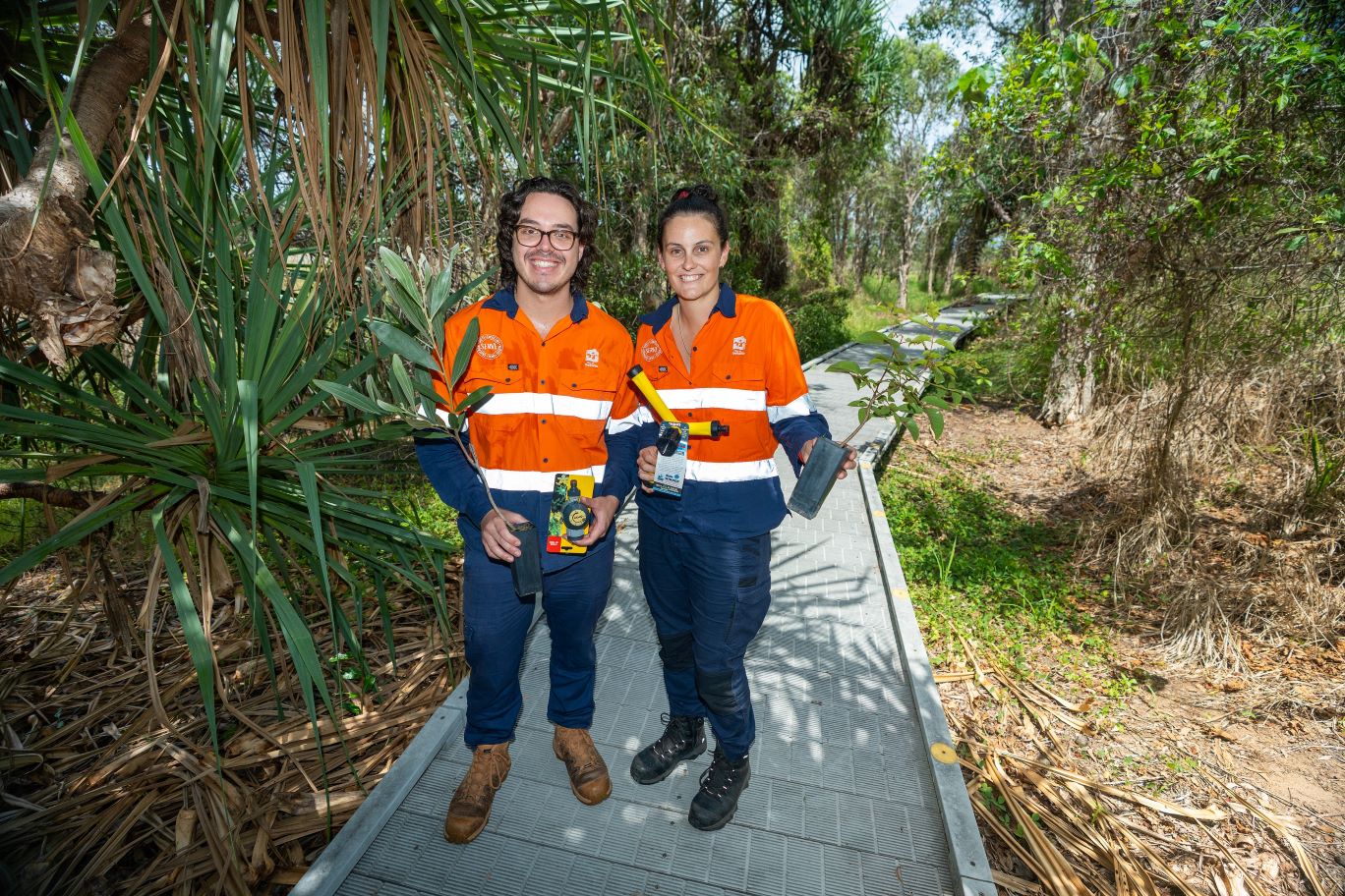 TCC Environment Team members Katie James and Matthew Greer at the wetlands boardwalk, located within the Rowes Bay Sustainability.