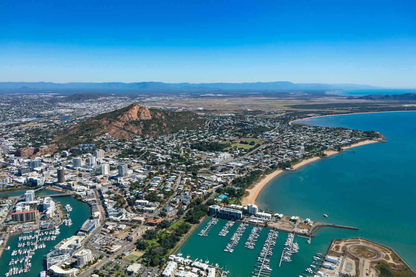 Aerial shot of Townsville's city centre, The Strand and northern suburbs in the distance.