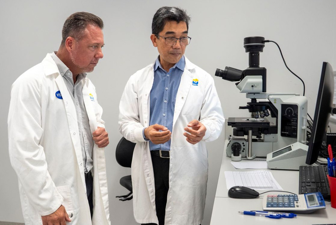 Mayor Nick Dametto with TLS Team Manager Edgar Salvador, discussing the lab’s work.