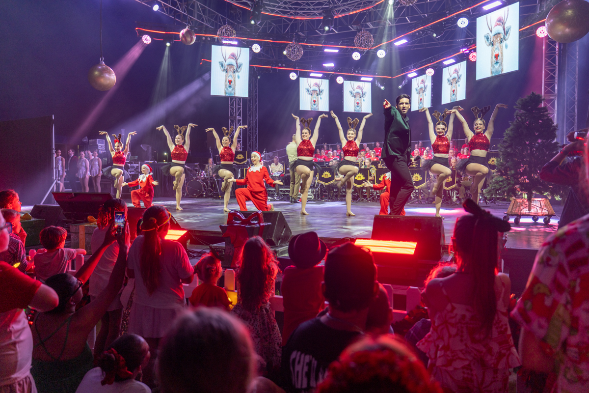 Audience watching performers at Carols by Candlelight 2025