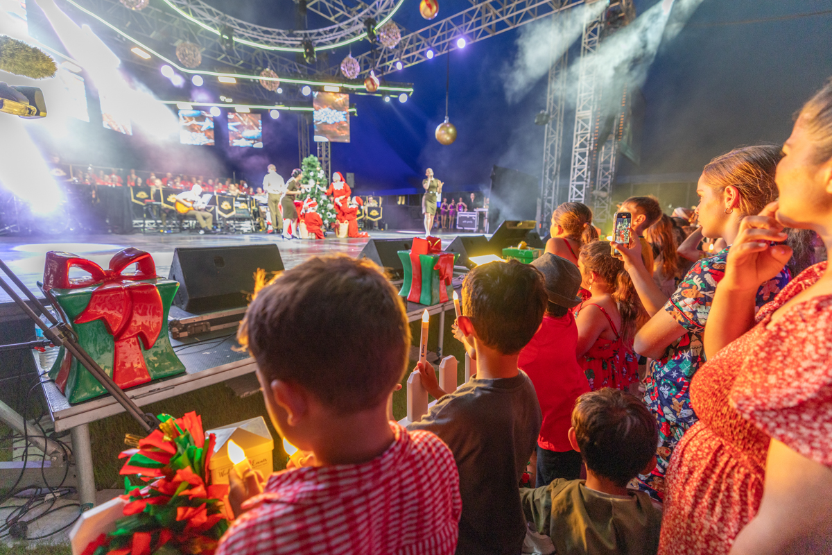 Audience watching performers at Carols by Candlelight 2025